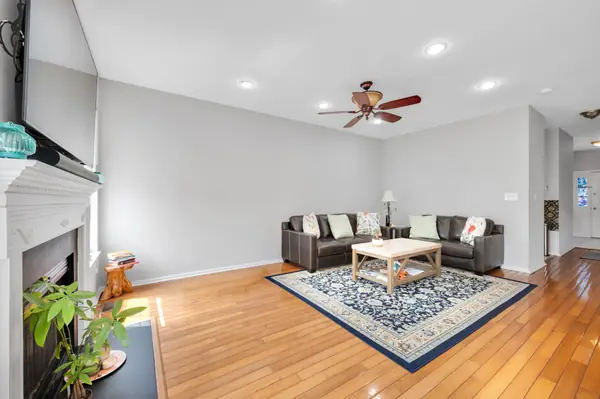 Living room with fireplace and mounted television