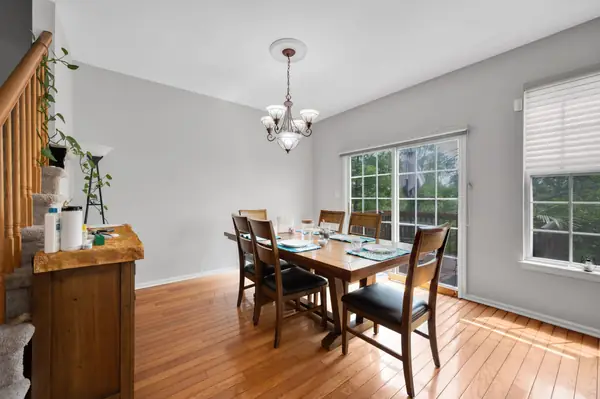 Dining room with chandelier and sliding doors to the deck
