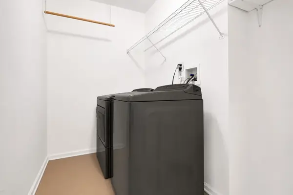 In-unit laundry room with washer and dryer